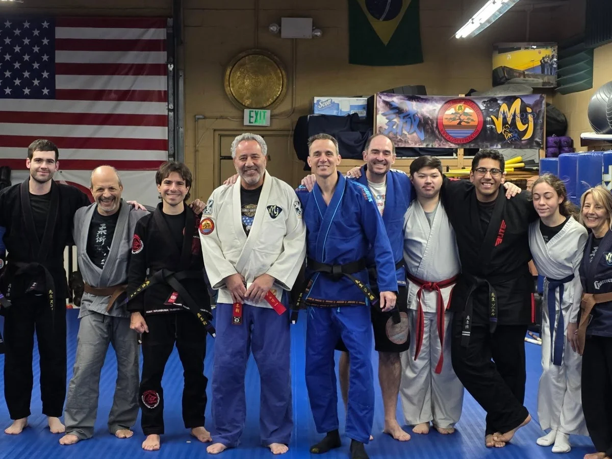 Students of all ages lined up together after class at Makoto Jiu Jitsu Centers in Deer Park